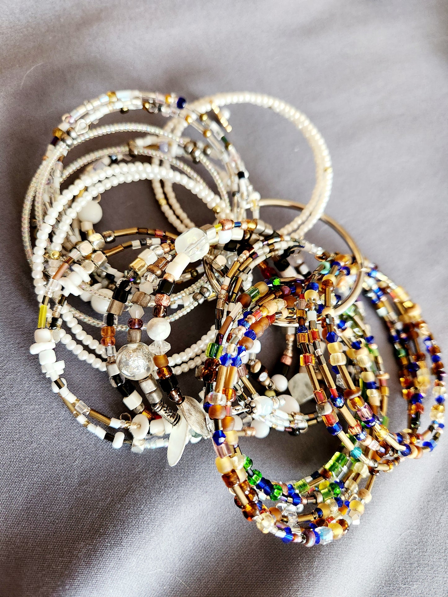 Bangle bracelet. Memory wire, beaded. Add-on charms available.