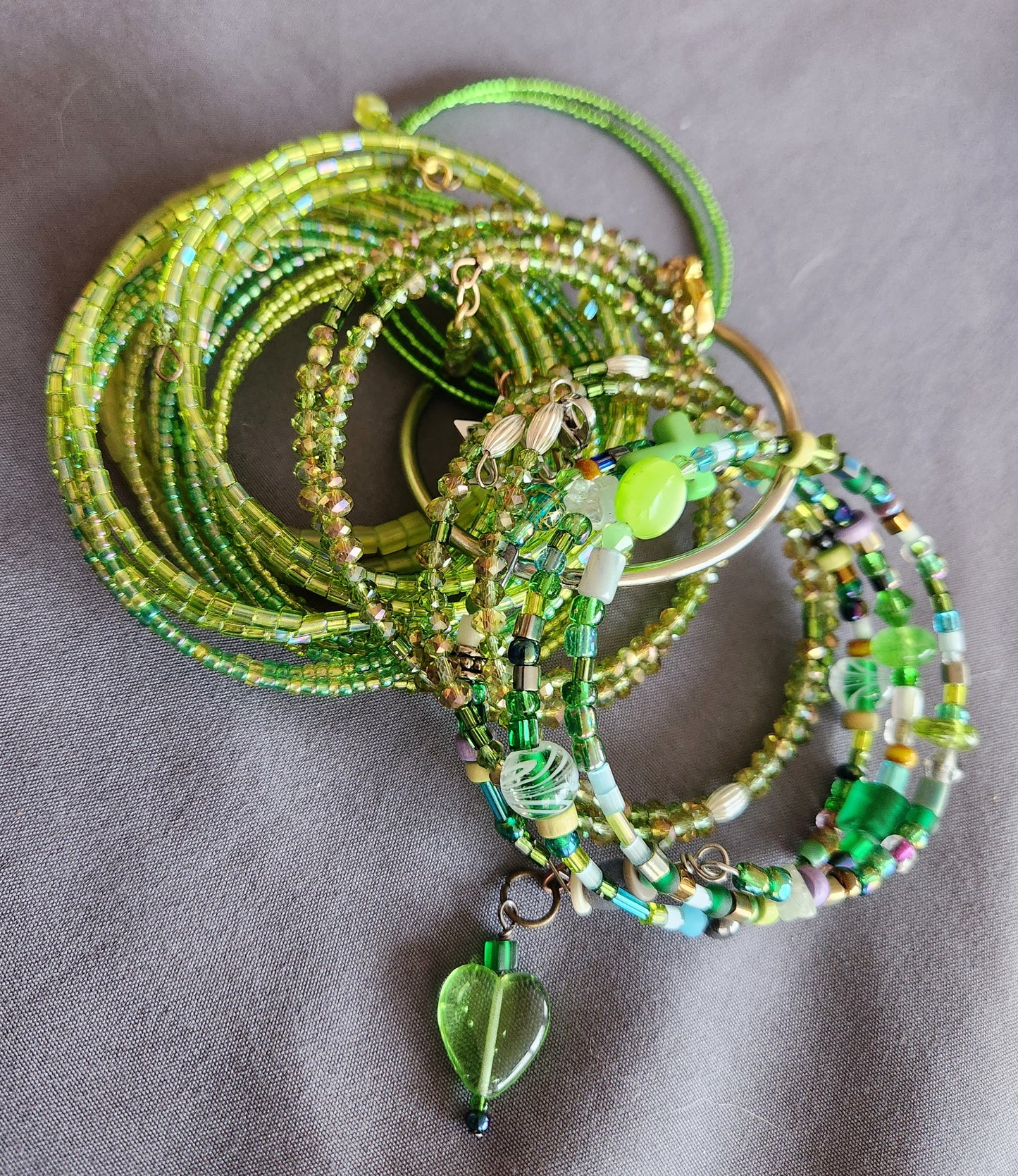 Bangle bracelet. Memory wire, beaded. Add-on charms available.