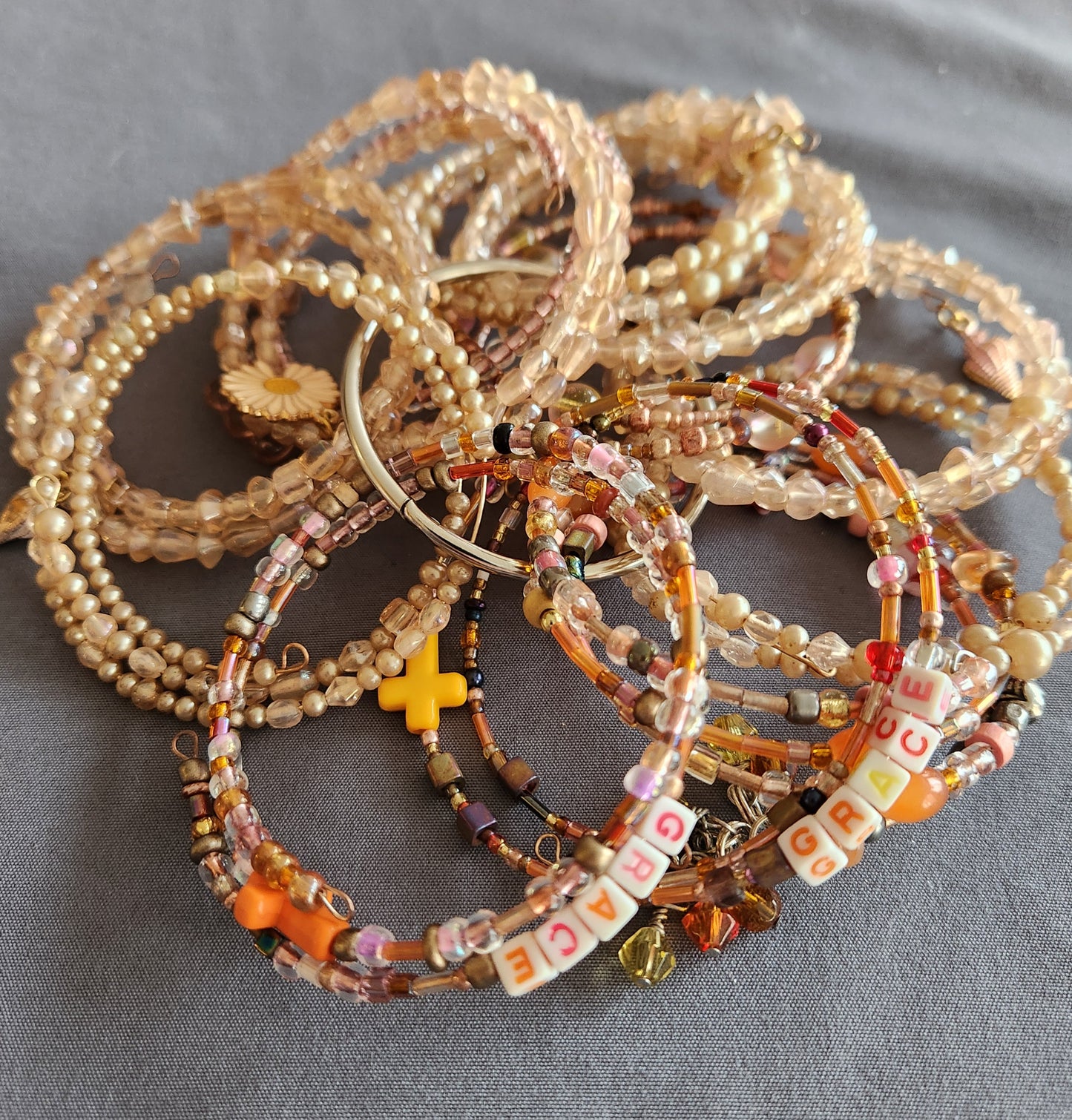 Bangle bracelet. Memory wire, beaded. Add-on charms available.