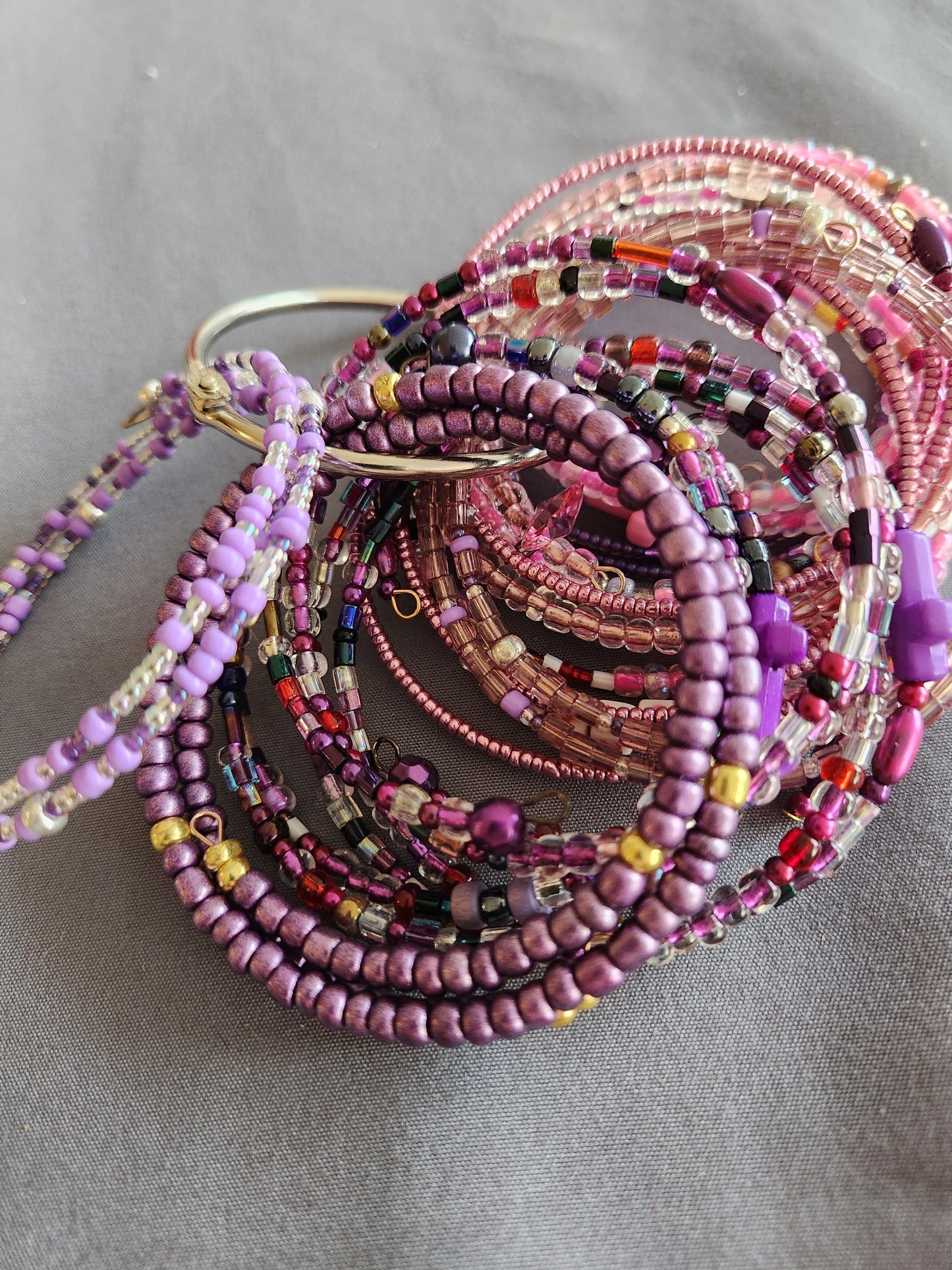 Bangle bracelet. Memory wire, beaded. Add-on charms available.